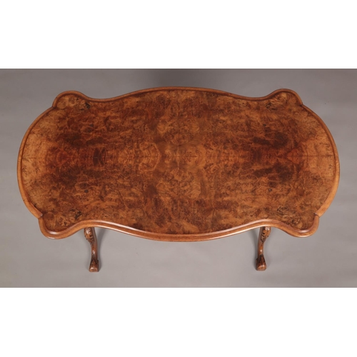 158 - A Victorian burr walnut centre table. With quarter veneered top and raised on turned and carved supp... 