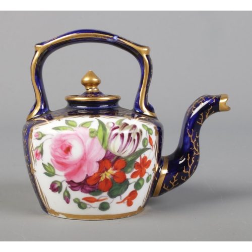 16 - A 19th century English porcelain miniature tea kettle, possibly by Coalport. Height 7cm.