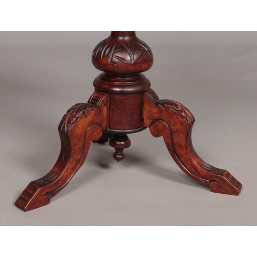 164 - A Victorian carved mahogany piano stool. Having upholstered seat and turned back rest. Height 68.5cm... 
