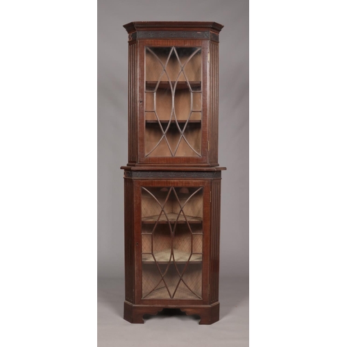 170 - An Edwardian mahogany astragal glazed corner cupboard. Height 208cm, Width 74cm.