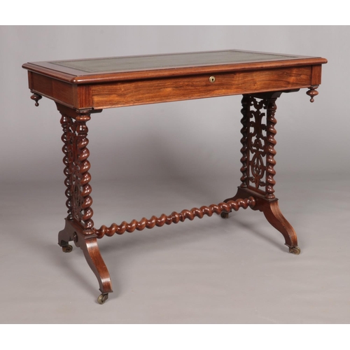 172 - A Victorian rosewood writing table. Having leather inset top, single drawer and barley twist support... 