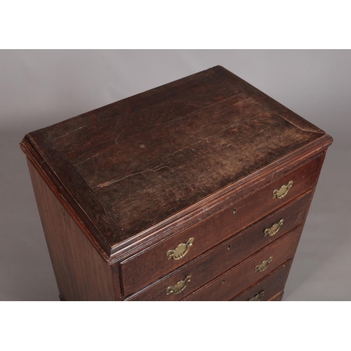 175 - A Georgian oak chest of four drawers raised on ogee bracket feet and having later brass handles. Hei... 
