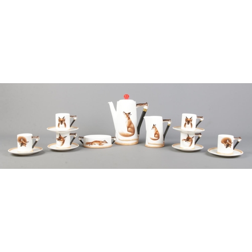 23 - A Royal Doulton bone china coffee set decorated in the Reynard The Fox design, H4927.