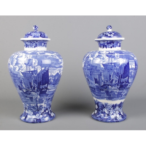 25 - A large pair of late 19th/early 20th century Wedgwood blue and white lidded vases decorated in the F... 