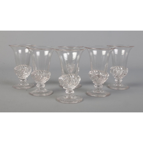 29 - A set of six Regency gadrooned jelly glasses, circa 1820. Height 10.5cm.