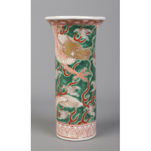 34 - A mid 20th century Chinese sleeve decorated in coloured enamels with dragons. Height 18cm.
