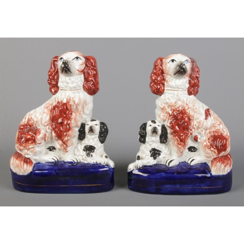5 - A pair of Victorian Staffordshire spaniels with their pups. Height 20cm.