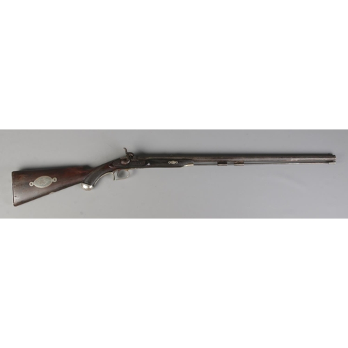 50 - A 19th century percussion rifle with white metal mounts. Having 72cm octagonal barrel. CAN NOT POST