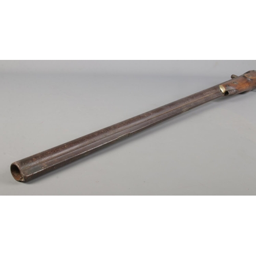 51 - A 19th century percussion rifle with walnut stock and brass mounts. Having Birmingham proof marks to... 