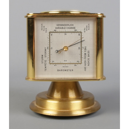 57 - A vintage brass Angelus desk clock/weather station. Having rotating cube shaped body with alarm cloc... 