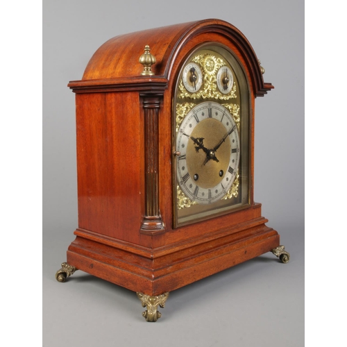 58 - An early 20th century mahogany dome top bracket clock by Winterhalder & Hofmeier. Having brass dial ... 