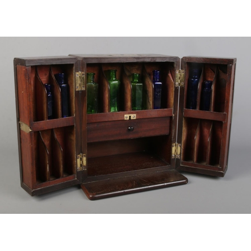 59 - A late 18th/early 19th century mahogany medicine cabinet with brass mounts. Having fitted interior a... 