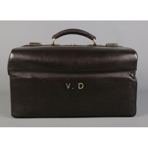 64 - An early 20th century leather dressing case by Asprey, Bond Street. Monogrammed VD.