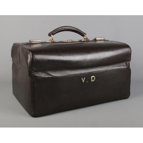 64 - An early 20th century leather dressing case by Asprey, Bond Street. Monogrammed VD.