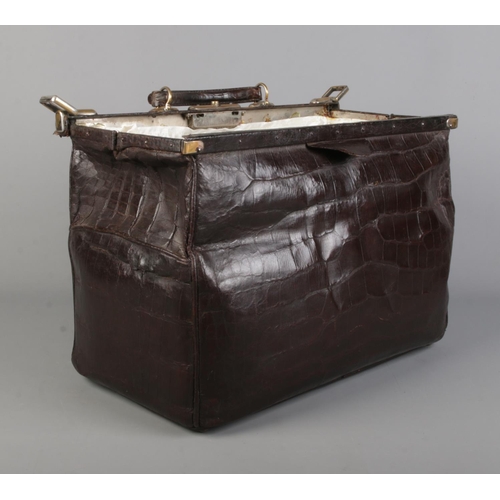 65 - A 19th century crocodile skin Gladstone bag. Closed measurements 23cm x 25cm x 45cm.