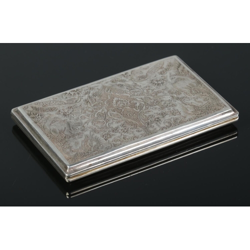 68 - A 20th century Persian silver cigarette case engraved to the front and back with birds, deer and flo... 
