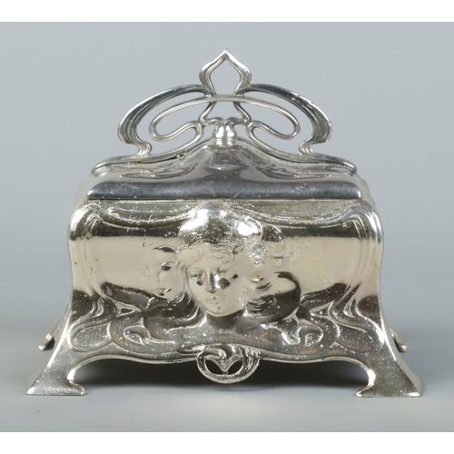 77 - A WMF silver plated jewellery casket in the Art Nouveau style. Having hinged cover and mask decorati... 
