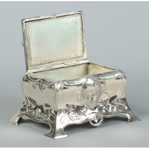 77 - A WMF silver plated jewellery casket in the Art Nouveau style. Having hinged cover and mask decorati... 