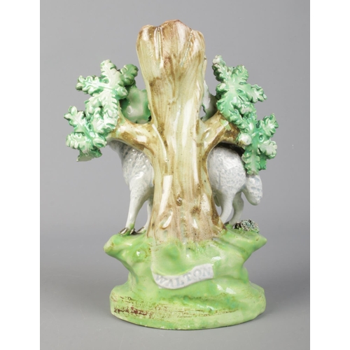 8 - A 19th century Staffordshire spill vase by John Walton, bocage group with ram and lamb. Height 18cm.
