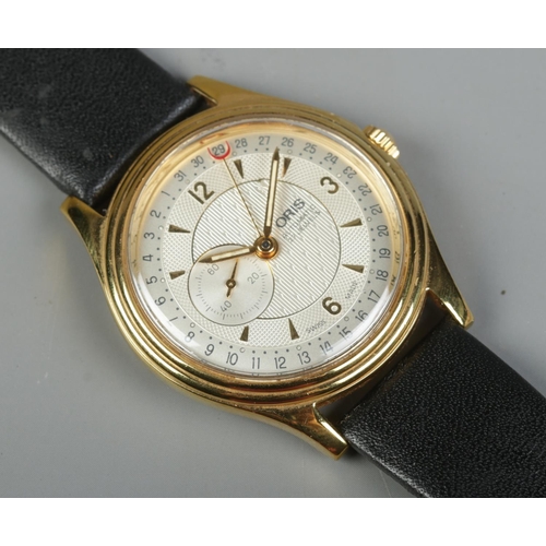 84 - A gents gold plated stainless steel Oris automatic wristwatch. Having champagne dial, baton and Arab... 