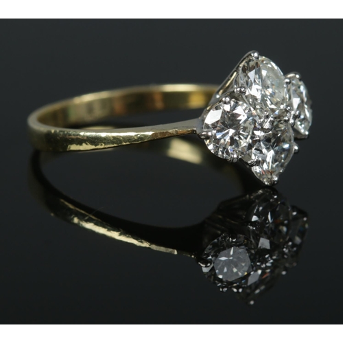85 - An 18ct gold and four stone diamond ring. The diamonds being round brilliant cut (approximately 2ct)... 