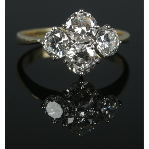 85 - An 18ct gold and four stone diamond ring. The diamonds being round brilliant cut (approximately 2ct)... 