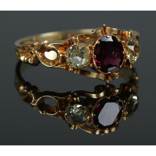 96 - An early to mid 19th century 18ct gold garnet and chrysoberyl three stone ring. Size R. 2.51g.