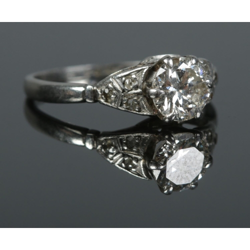 99 - An Art Deco platinum and diamond ring. Size L. 3.18g. Central diamond just over 0.5ct.