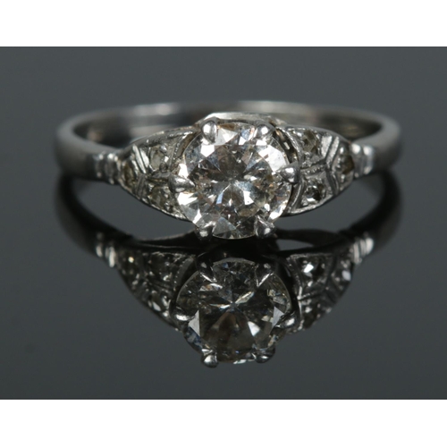 99 - An Art Deco platinum and diamond ring. Size L. 3.18g. Central diamond just over 0.5ct.