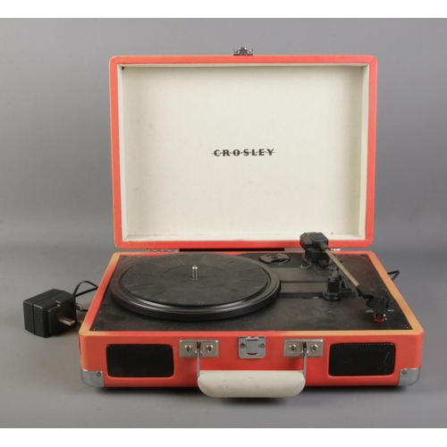 253 - A Crosley portable record player. Model No. CR8005A-OR