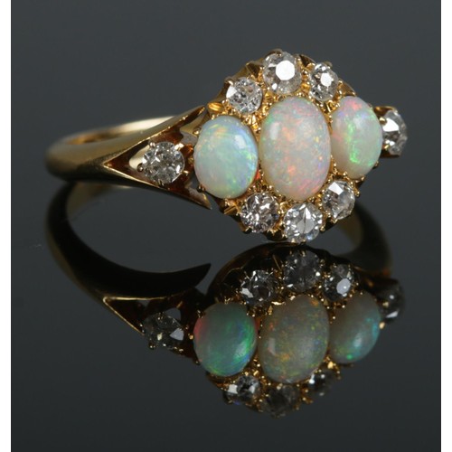 93 - An early 20th century 18ct gold, opal and diamond cluster ring. Hallmarks for Birmingham, 1912. Size... 