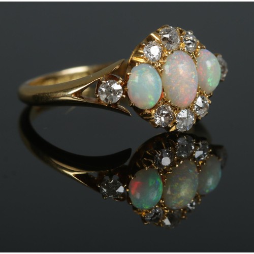 93 - An early 20th century 18ct gold, opal and diamond cluster ring. Hallmarks for Birmingham, 1912. Size... 