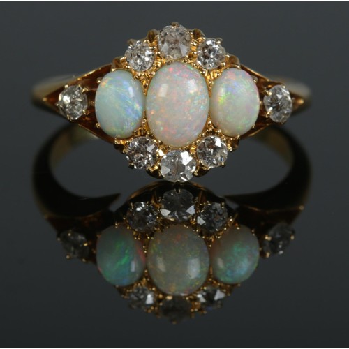 93 - An early 20th century 18ct gold, opal and diamond cluster ring. Hallmarks for Birmingham, 1912. Size... 