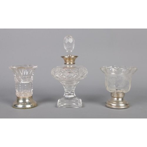 483 - A collection of silver footed and collared 
glassware. To include cigarette bowl, scent bottle and s... 