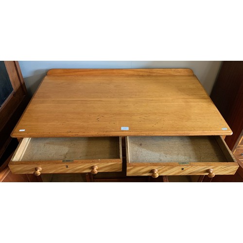 177 - A Victorian satin birch desk. Having two drawers over three cupboard doors. Height 81cm, Width 114cm... 