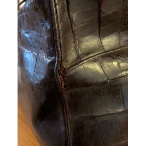 65 - A 19th century crocodile skin Gladstone bag. Closed measurements 23cm x 25cm x 45cm.