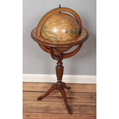 500 - A globe on mahogany stand with star sign border. Approximately 90cm.