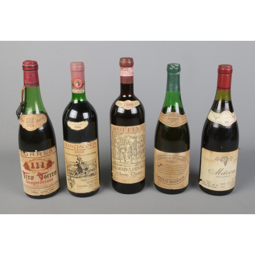 255 - Five sealed bottles of vintage alcohol to include 1986 Ruffino, 1984 Franciacorta, 1974 Tres Torres,... 