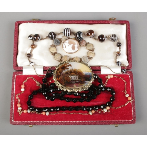 260 - A collection of costume jewellery, to include cameo brooch and bracelet, banded agate beads, coral a... 