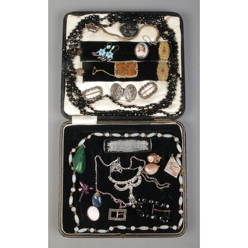 262 - A large cutlery box containing a variety of costume jewellery. To include French jet beads, Victoria... 