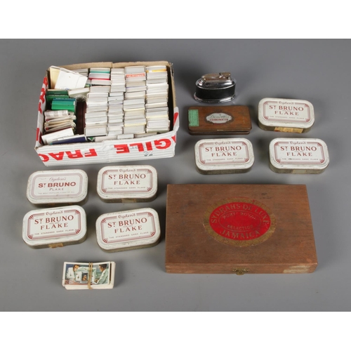 275 - A collection of smoking related items to include Ogden's tobacco tins, large collection of matchboxe... 