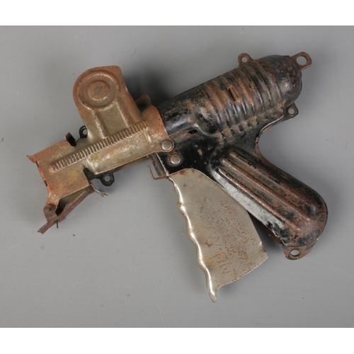 278 - A 1930's Langson Nu-Matic paper buster/popper gun. Mechanism working.