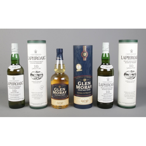 279 - Three cased and sealed bottles of whisky, to include two Laphroaig Islay Single Malt Scotch Whisky (... 