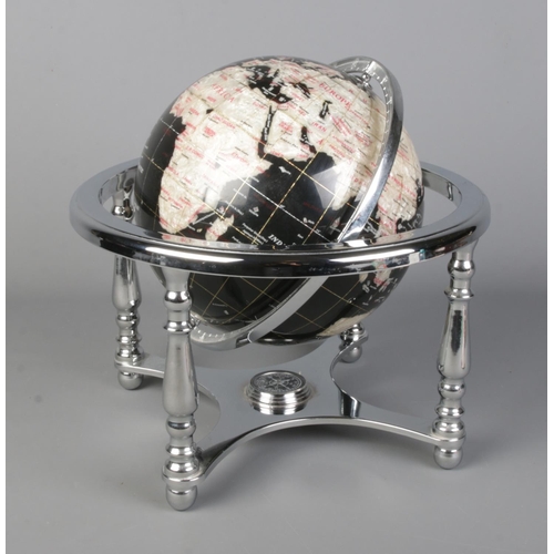 280 - A gemstone globe, with chrome supports and deep blue backing set with mother of pearl for the countr... 