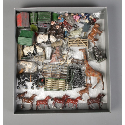 281 - A collection of painted lead figures to include farmyard and and zoological examples.