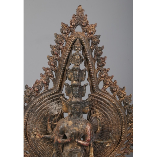 290 - A cast metal figure formed as a thousand arm deity/Avalokiteshvara. Height 40.5cm.