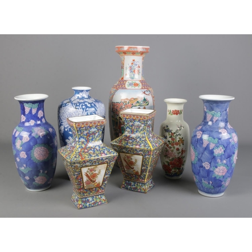 292 - A good collection of large oriental vases. Includes two pairs, one with character marks to base. Hei... 