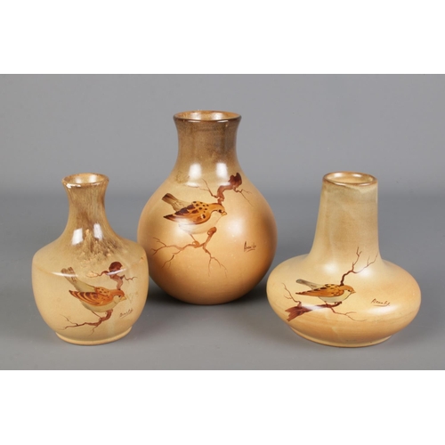 295 - Three mid century studio pottery vases, hand painted with birds. Signed Arnaldo, possibly Arnaldo Mi... 