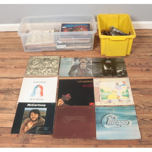 309 - A box of assorted vinyl records and one box of singles, mainly pop and easy listening. To include Th... 