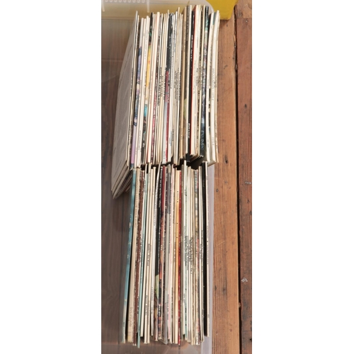 309 - A box of assorted vinyl records and one box of singles, mainly pop and easy listening. To include Th... 